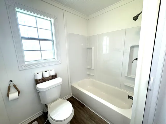 a bathroom with a bathtub toilet and sink
