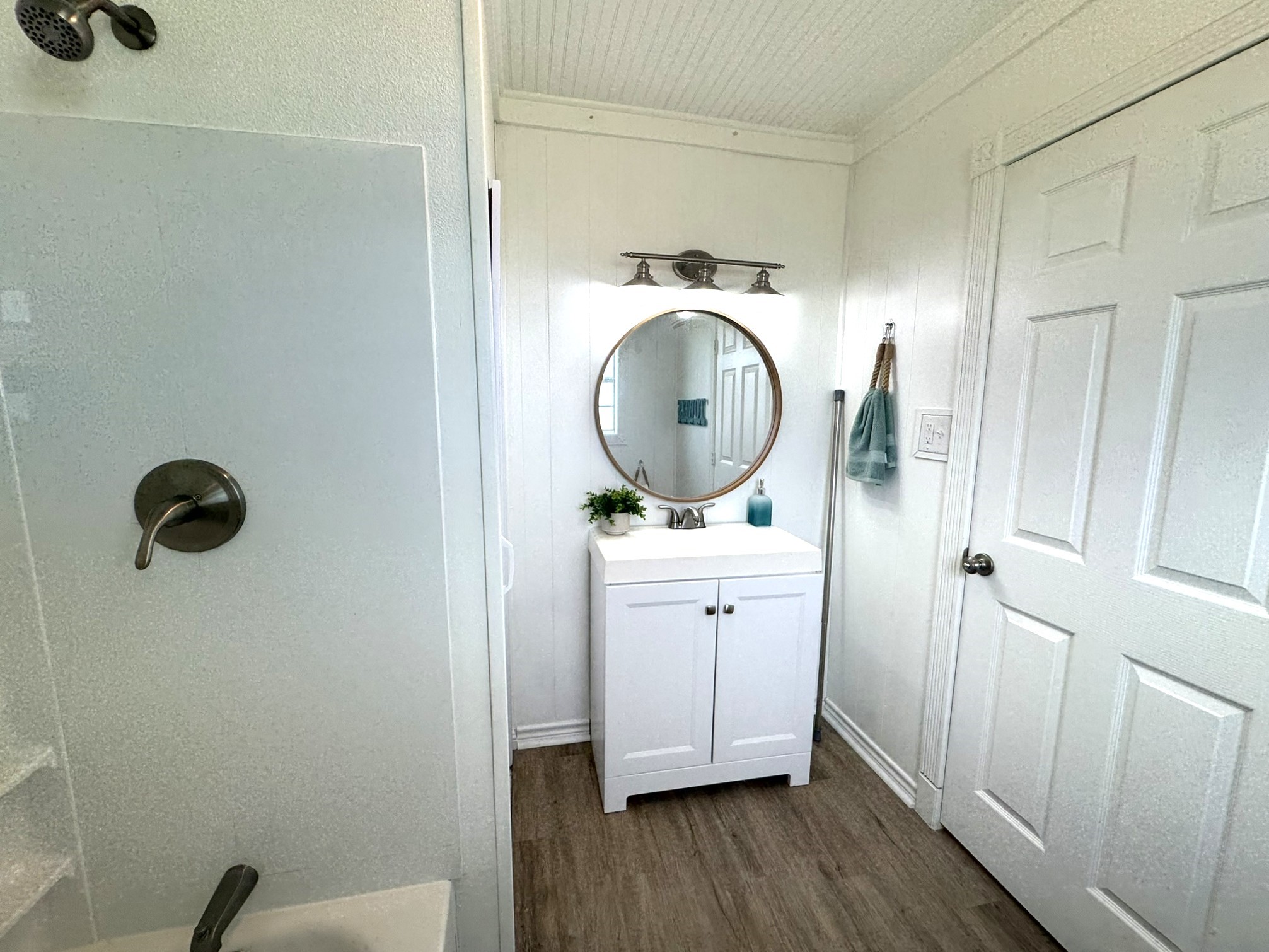 302 2nd Street Palacios, TX 77465 - Photo 31 of 45 a close view of utility room with wooden floor