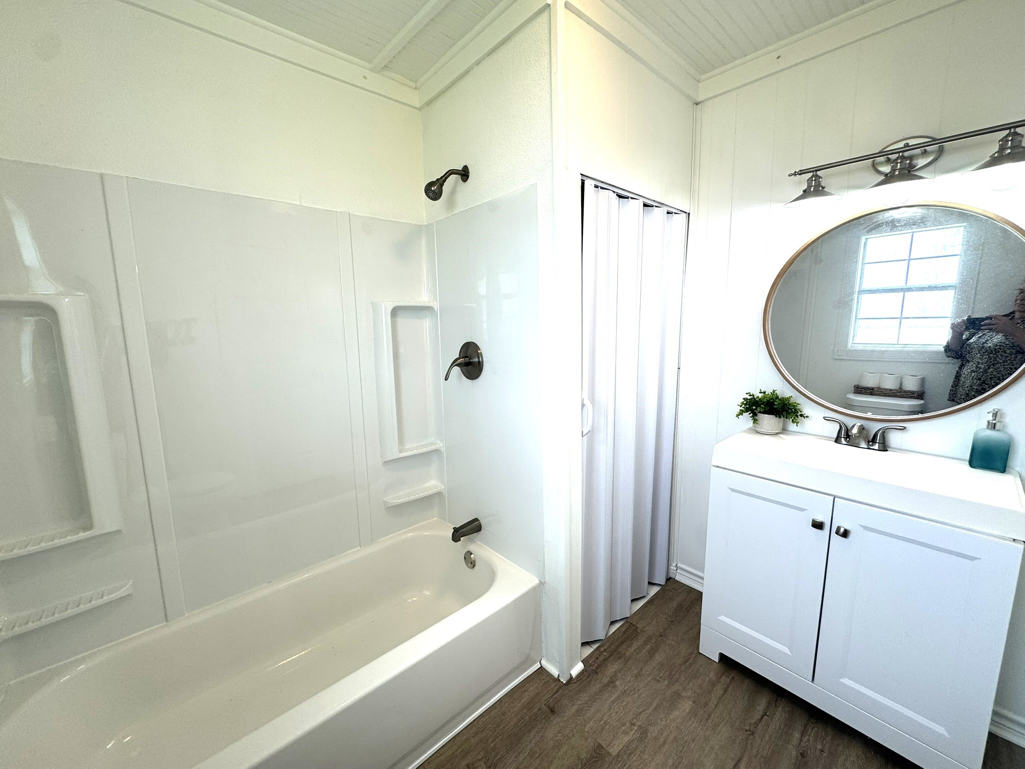 302 2nd Street Palacios, TX 77465 - Photo 32 of 45 a bathroom with a tub sink and mirror