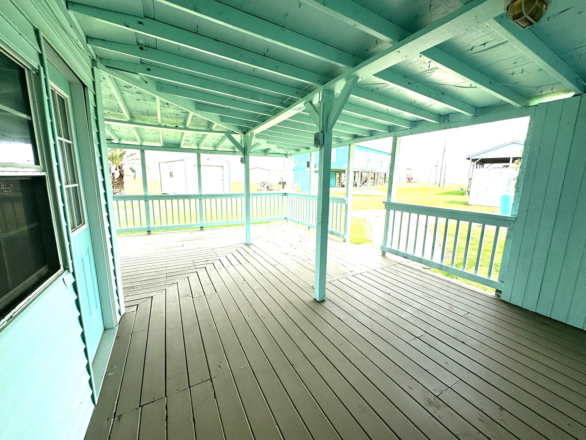 302 2nd Street Palacios, TX 77465 - Photo 33 of 45 a view of porch with wooden floor