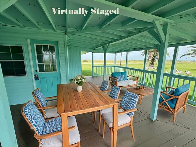 a view of an outdoor sitting area with furniture and backyard