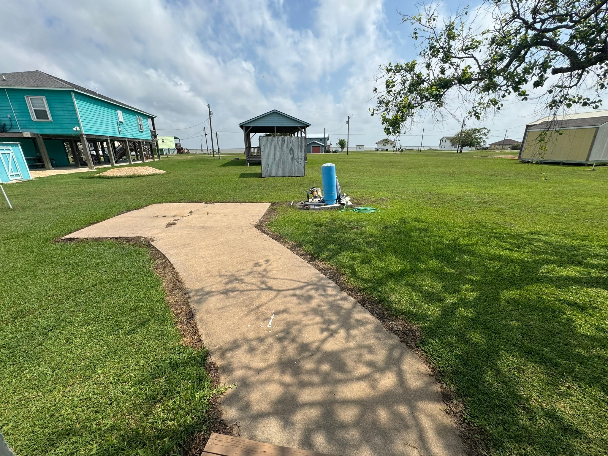 302 2nd Street Palacios, TX 77465 - Photo 38 of 45 a view of a park with a large trees and plants