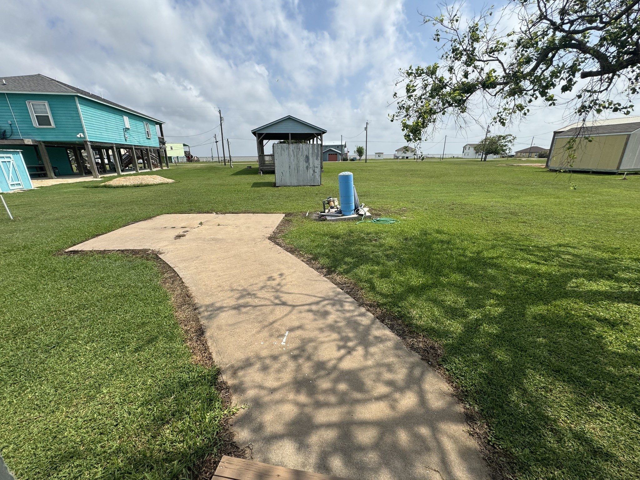 302 2nd Street Palacios, TX 77465 - Photo 38 of 45 a view of a park that has large trees with wooden fence