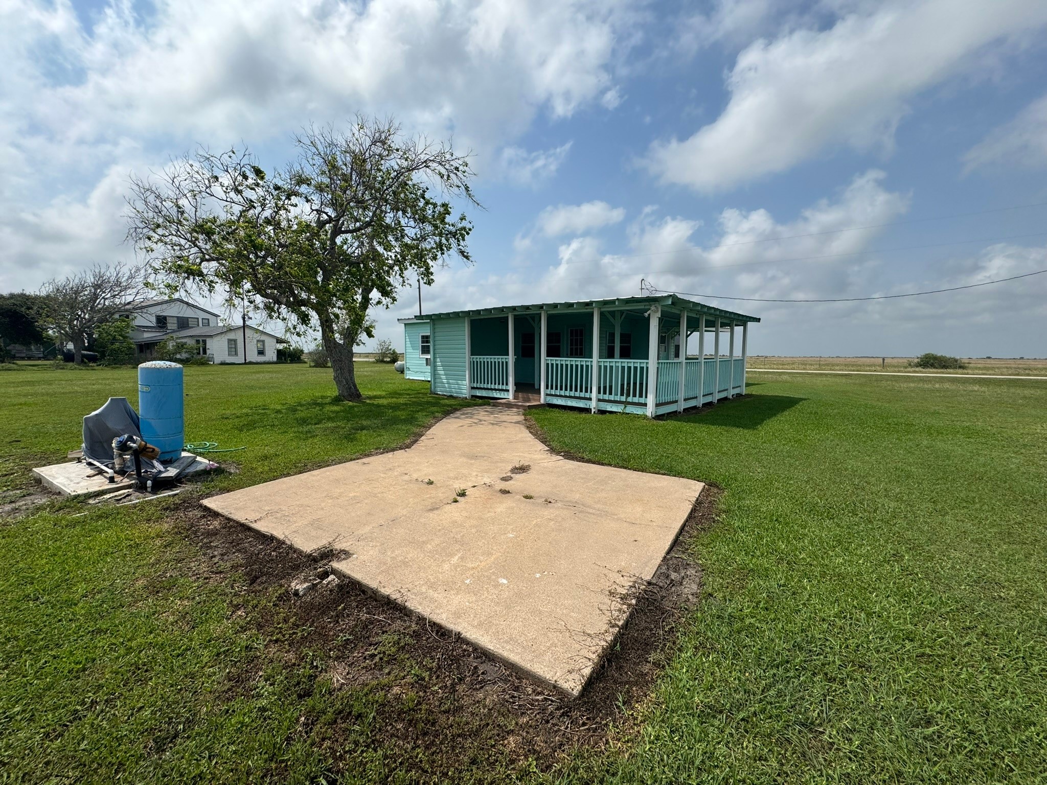 302 2nd Street Palacios, TX 77465 - Photo 39 of 45 a view of a house with a yard and sitting area