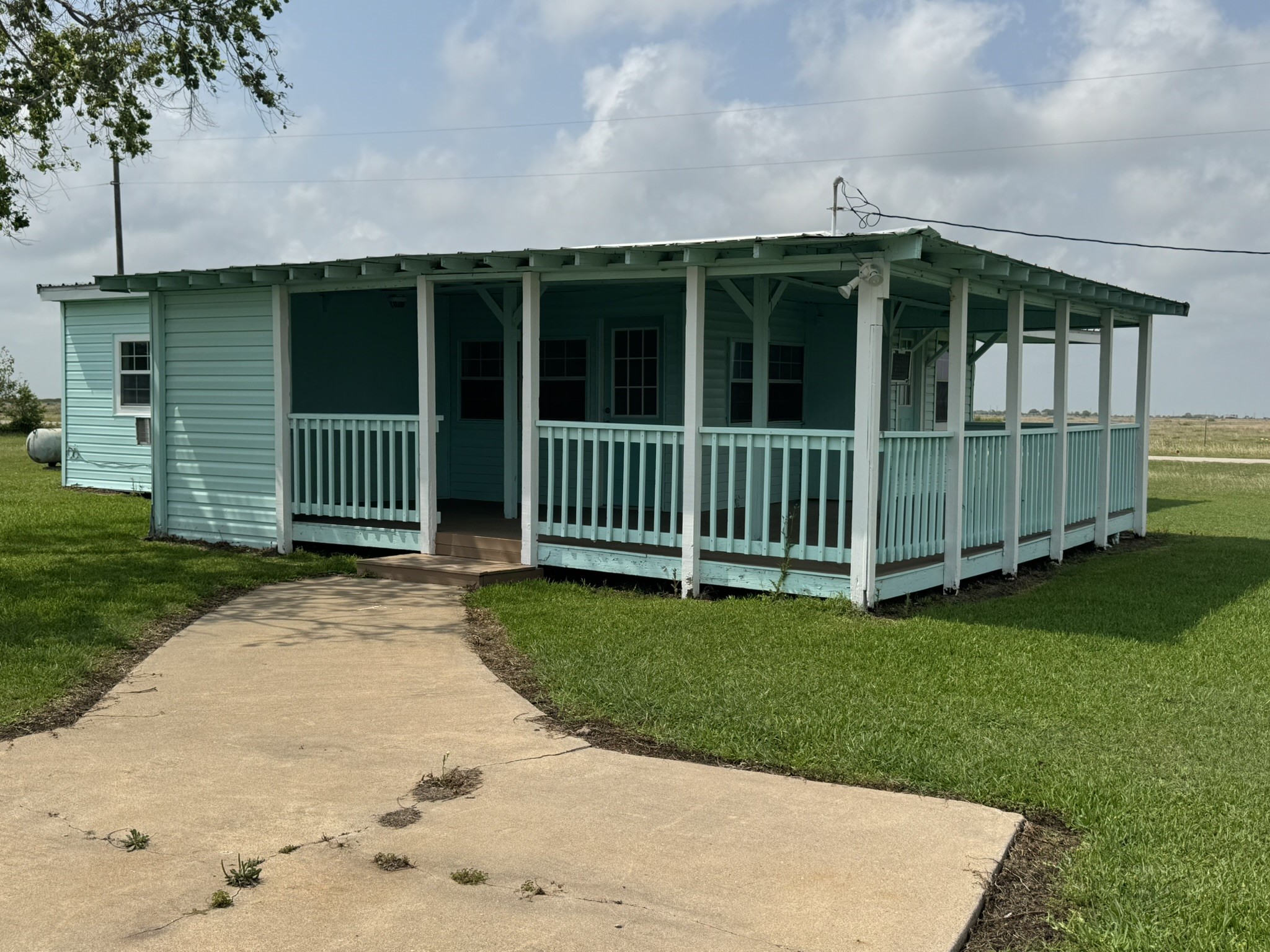 302 2nd Street Palacios, TX 77465 - Photo 40 of 45 a view of a house with a yard and a garden