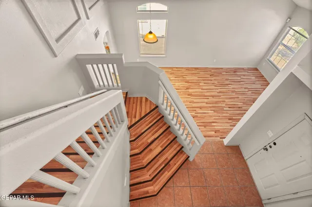 a view of staircase with black and white walls