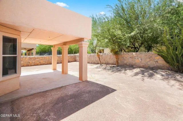 a view of a backyard of a house