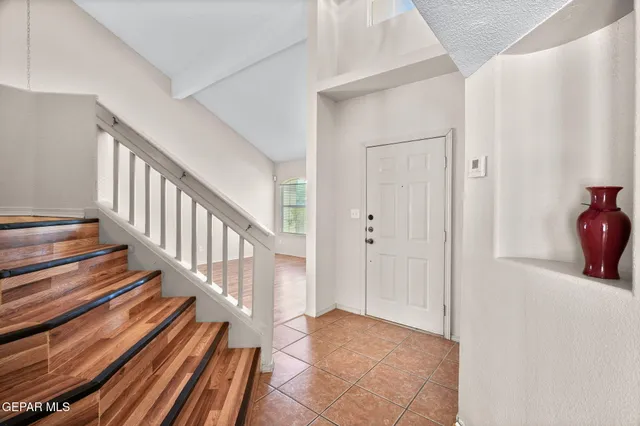 a view of entryway with wooden floor