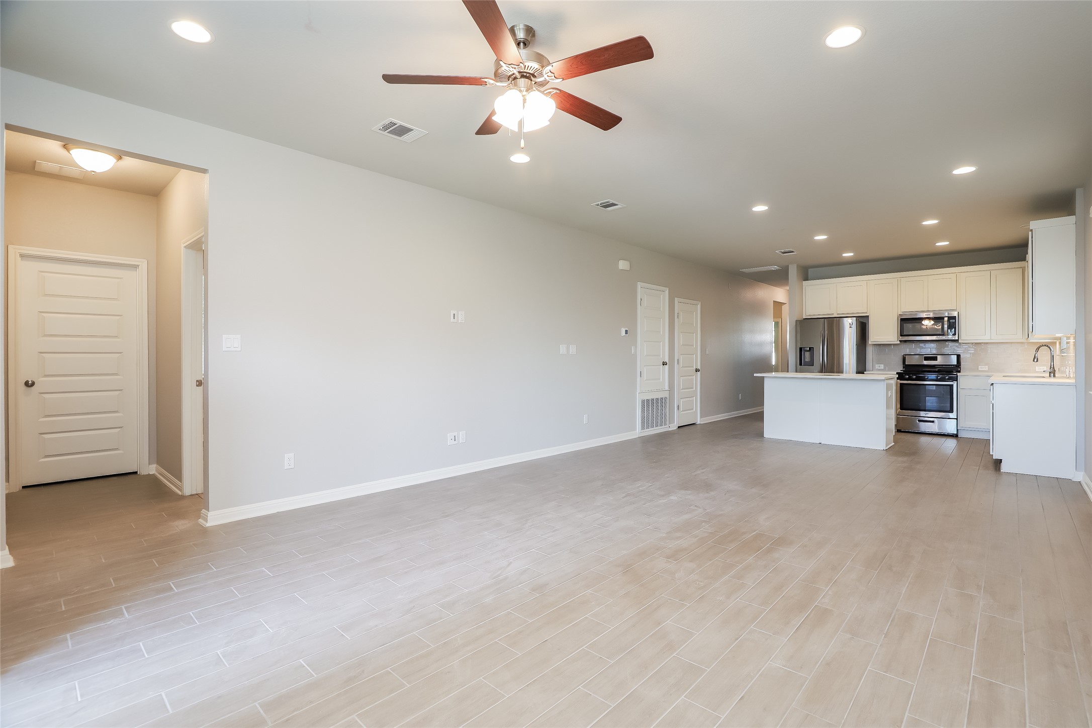 2724 Juniper Woods Road Leander, TX 78641 - Photo 6 of 21 An open-concept living space integrates a well-appointed kitchen, ideal for modern living.
