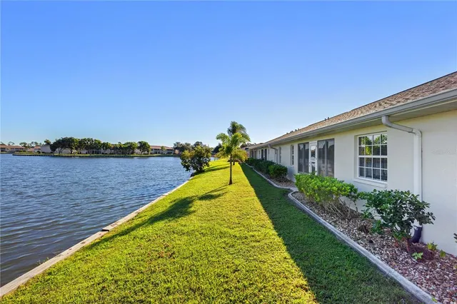 a view of a lake with a house in the background