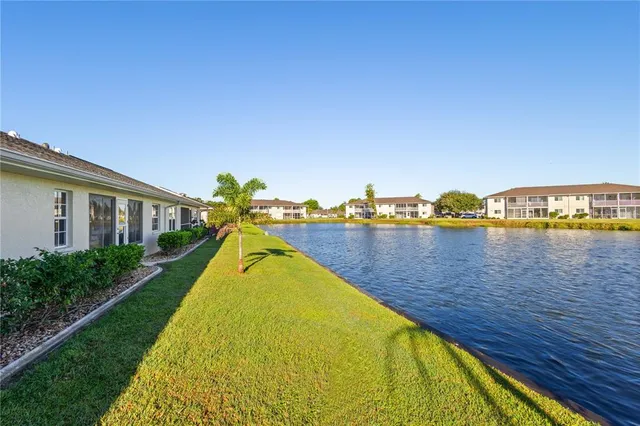 a view of a swimming pool with an outdoor seating