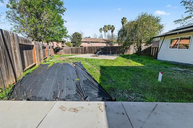 a view of backyard with a garden and entertaining space