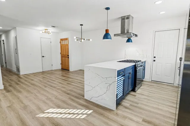 a kitchen with a sink and a refrigerator