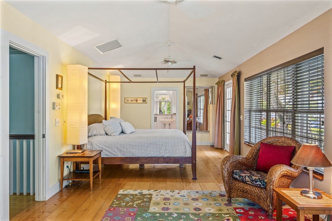 3628 Rio Vista Boulevard Vero Beach, FL 32963 - Photo 12 of 29 a bedroom with a bed and wooden floor