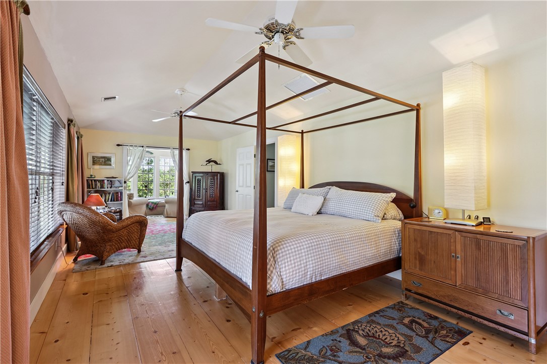 3628 Rio Vista Boulevard Vero Beach, FL 32963 - Photo 13 of 29 a bed room with a bed and wooden floor