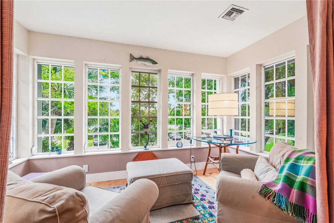 3628 Rio Vista Boulevard Vero Beach, FL 32963 - Photo 14 of 29 a living room with furniture and floor to ceiling windows