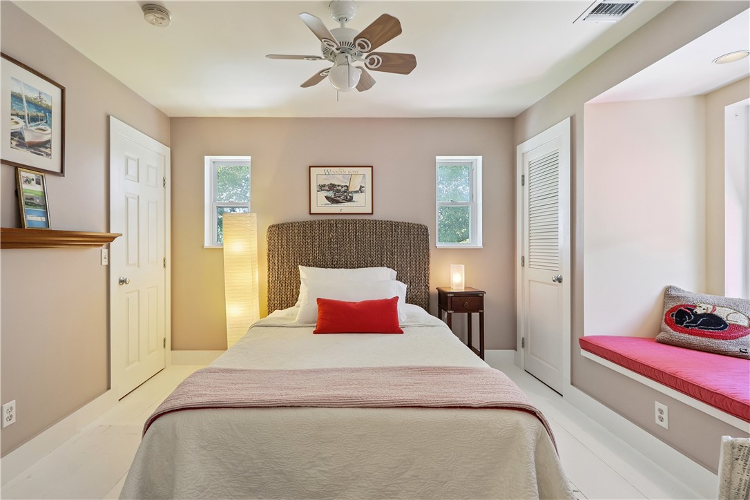 3628 Rio Vista Boulevard Vero Beach, FL 32963 - Photo 17 of 29 a bedroom with a large bed and a chandelier