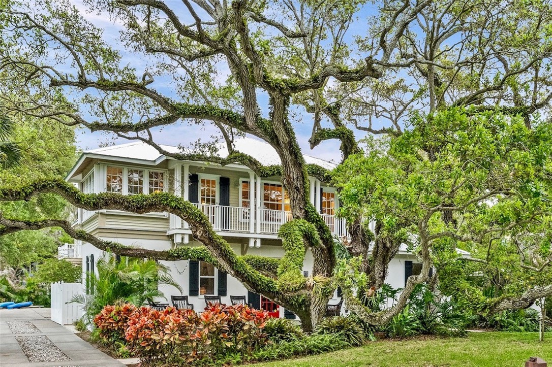 3628 Rio Vista Boulevard Vero Beach, FL 32963 - Photo 26 of 29 a front view of a house with a garden