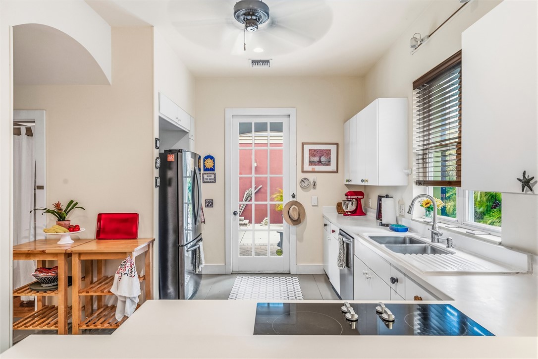 3628 Rio Vista Boulevard Vero Beach, FL 32963 - Photo 7 of 29 a kitchen with a sink stove and refrigerator