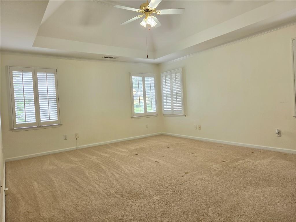 3715 Ridgeside Court Suwanee, GA 30024 - Photo 24 of 44 an empty room with a window and a ceiling fan