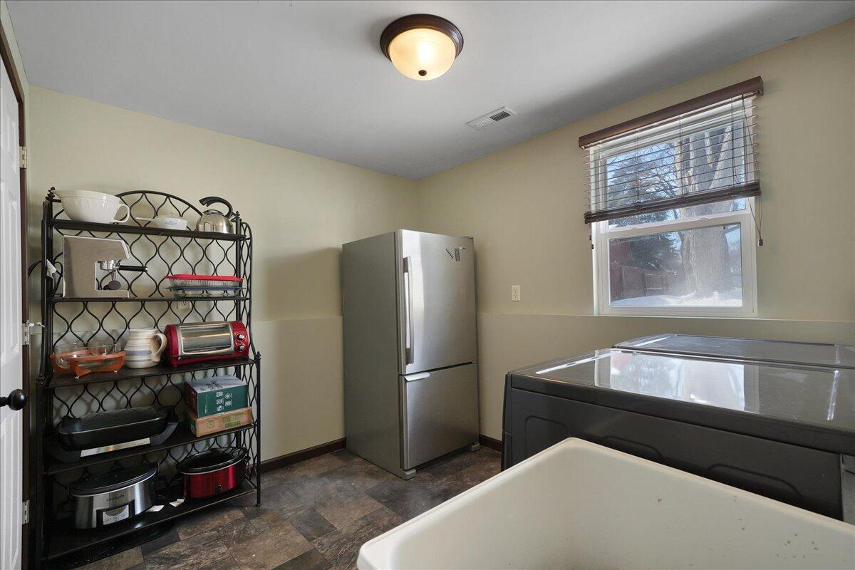 854 Fairview Street Westville, IN 46391 - Photo 16 of 19 a kitchen with stainless steel appliances granite countertop a refrigerator and a sink