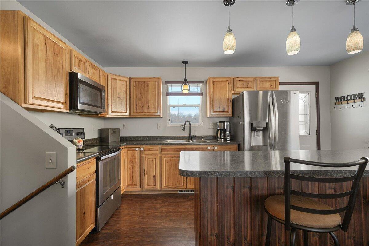 854 Fairview Street Westville, IN 46391 - Photo 6 of 19 a kitchen with stainless steel appliances granite countertop a stove top oven a refrigerator a sink and dishwasher