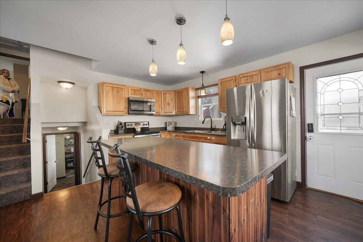 854 Fairview Street Westville, IN 46391 - Photo 7 of 19 a kitchen with stainless steel appliances granite countertop a refrigerator a sink dishwasher a stove and a refrigerator with wooden floor
