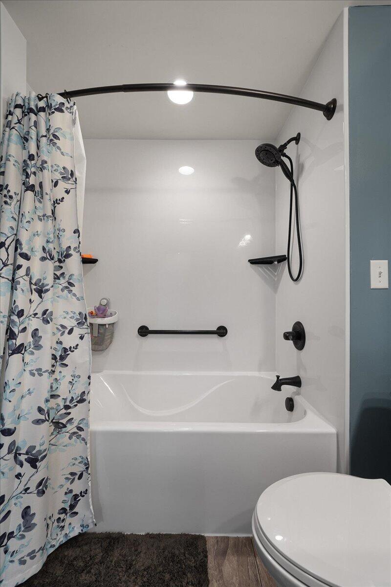 854 Fairview Street Westville, IN 46391 - Photo 9 of 19 a bathroom with a white toilet and a shower