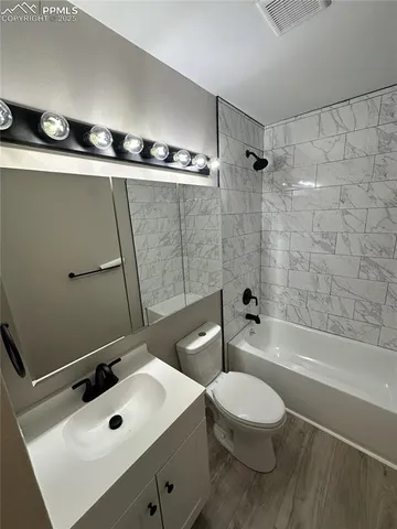 a bathroom with a sink a toilet and a bathtub