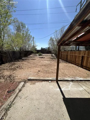 a view of a backyard of the house
