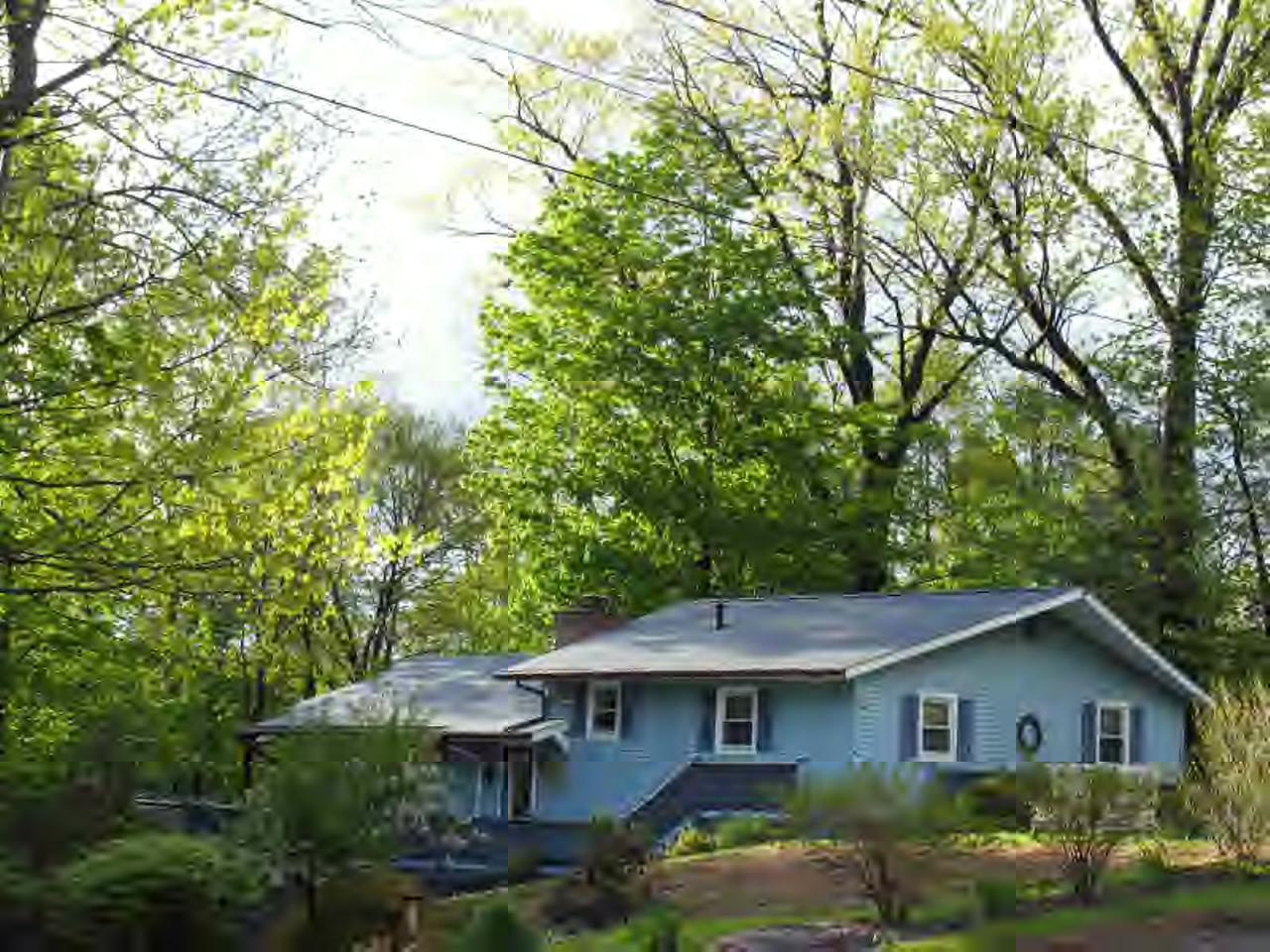 83 Lake Road Richmond, MA 01201 - Photo 1 of 6 front view of a house with a yard