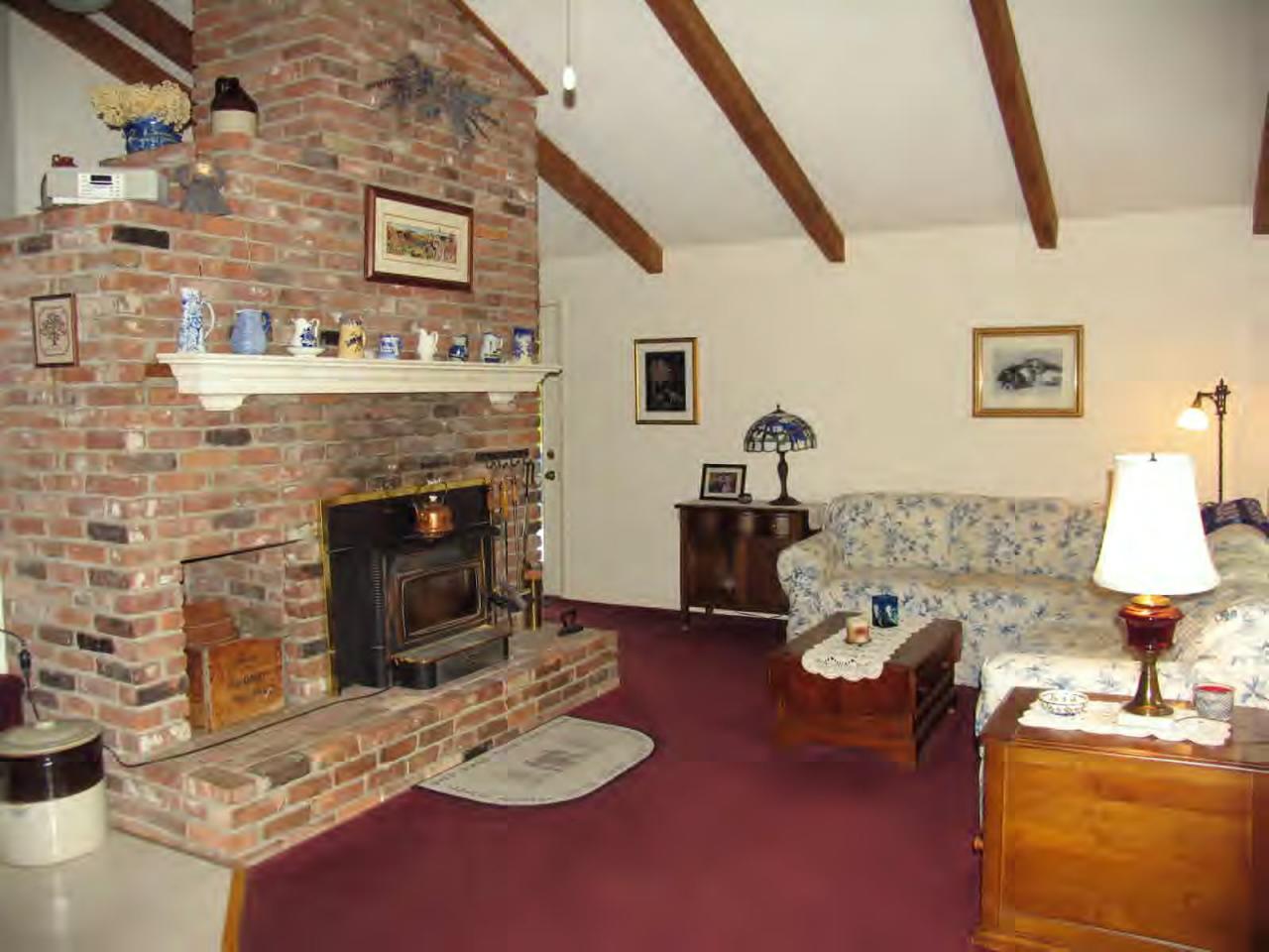 83 Lake Road Richmond, MA 01201 - Photo 2 of 6 a living room with furniture and a fireplace