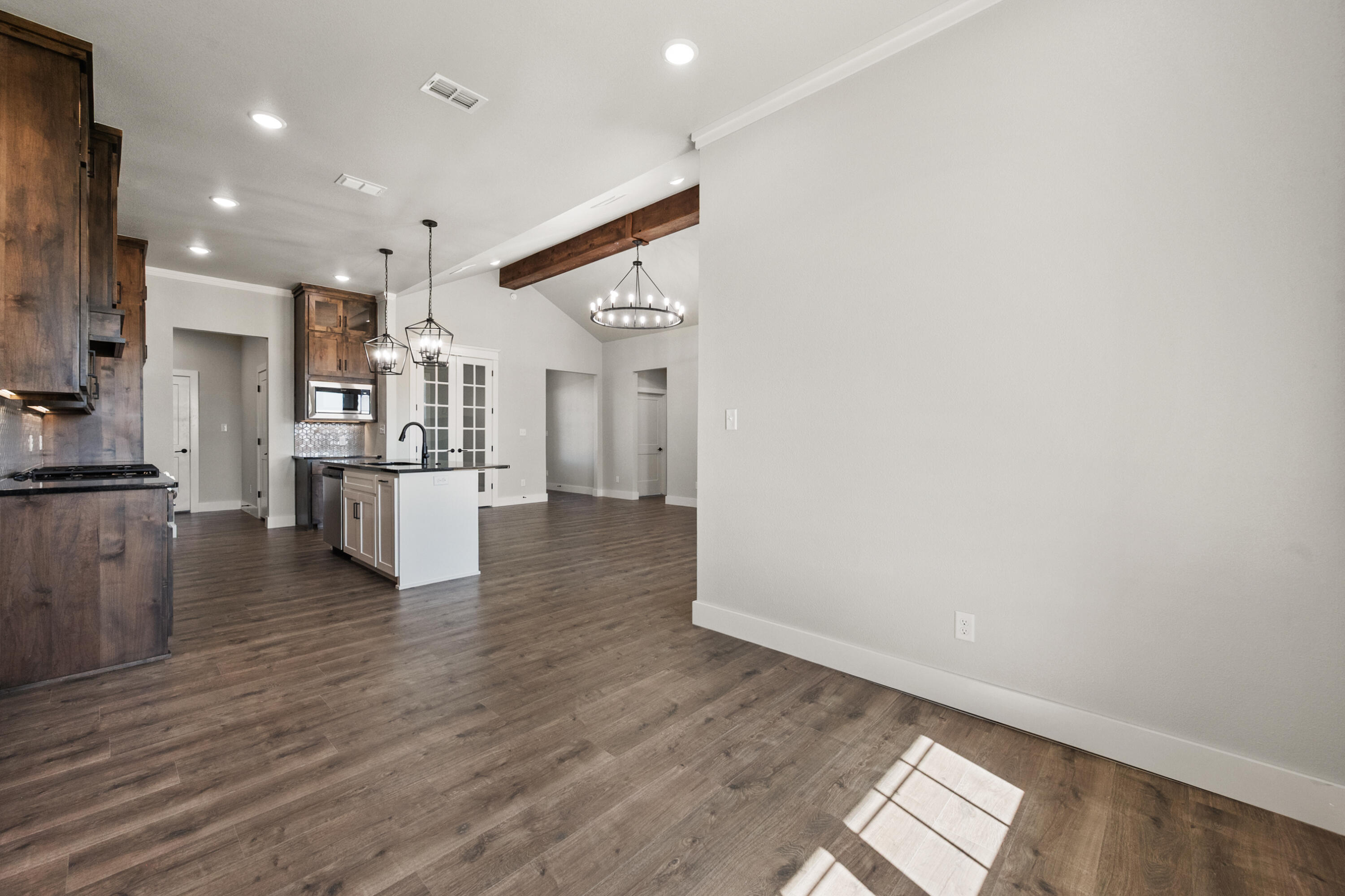 1119 North 6th Street Wolfforth, TX 79382 - Photo 15 of 37 a view of kitchen view wooden floor and window