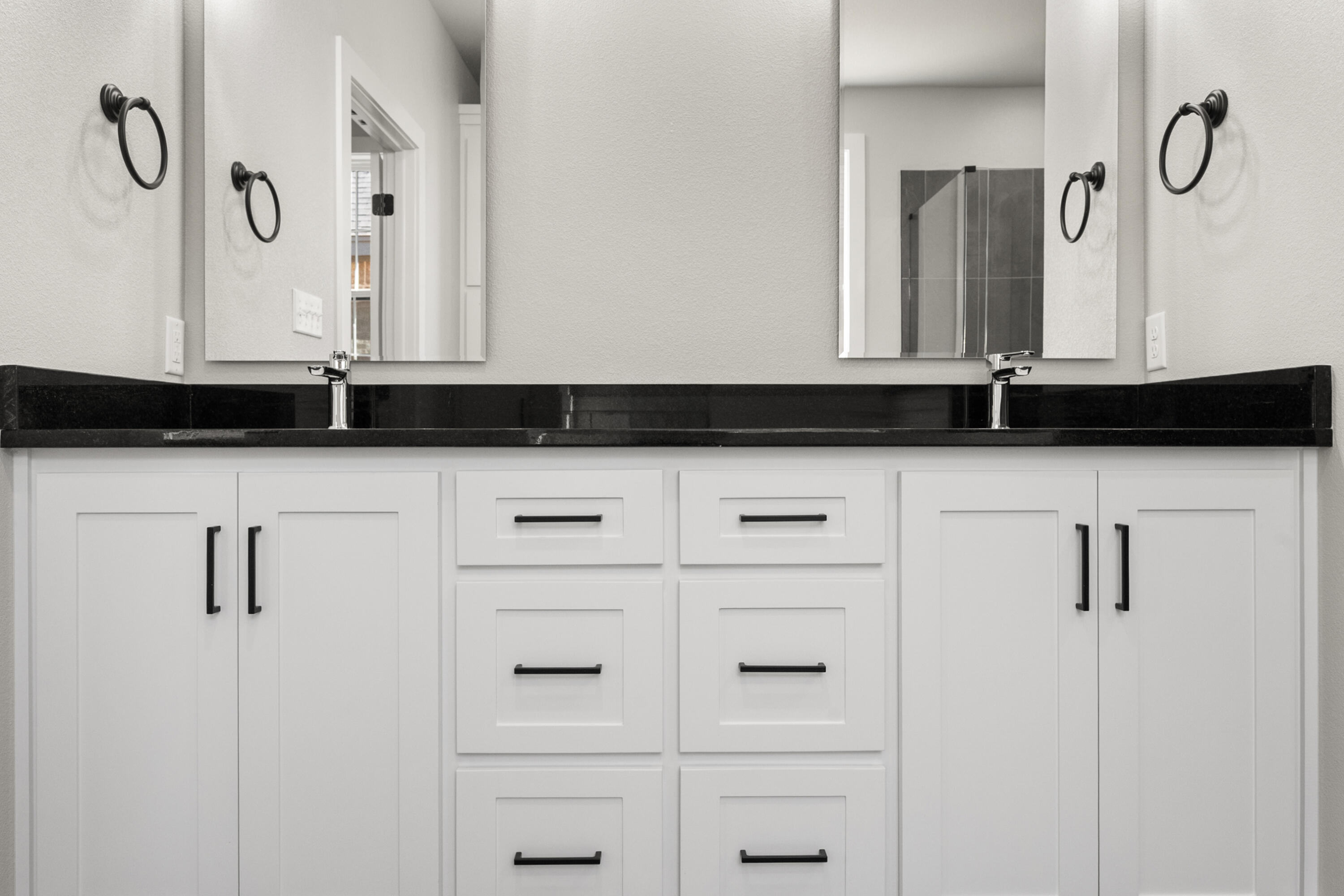 1119 North 6th Street Wolfforth, TX 79382 - Photo 22 of 37 a bathroom with a granite countertop sink and a mirror