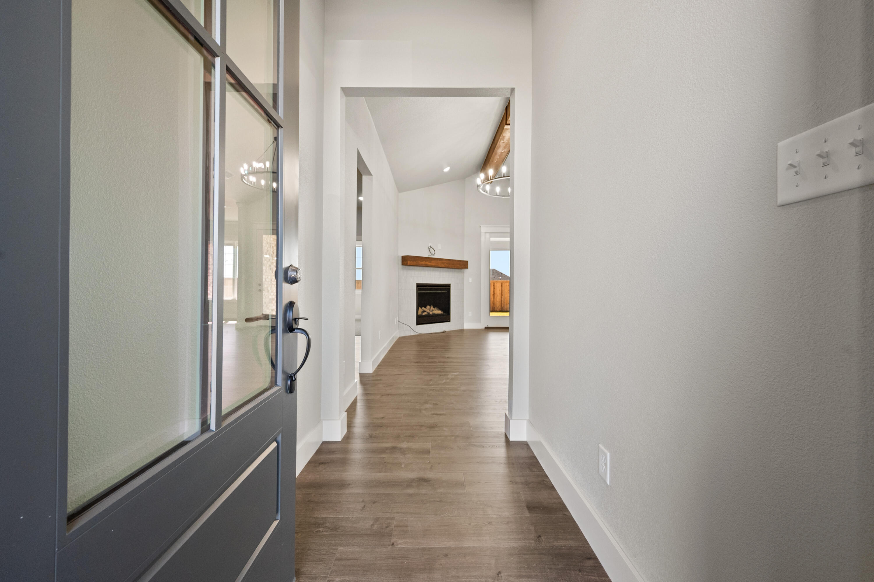 1119 North 6th Street Wolfforth, TX 79382 - Photo 3 of 37 a view of a hallway with wooden floor and staircase