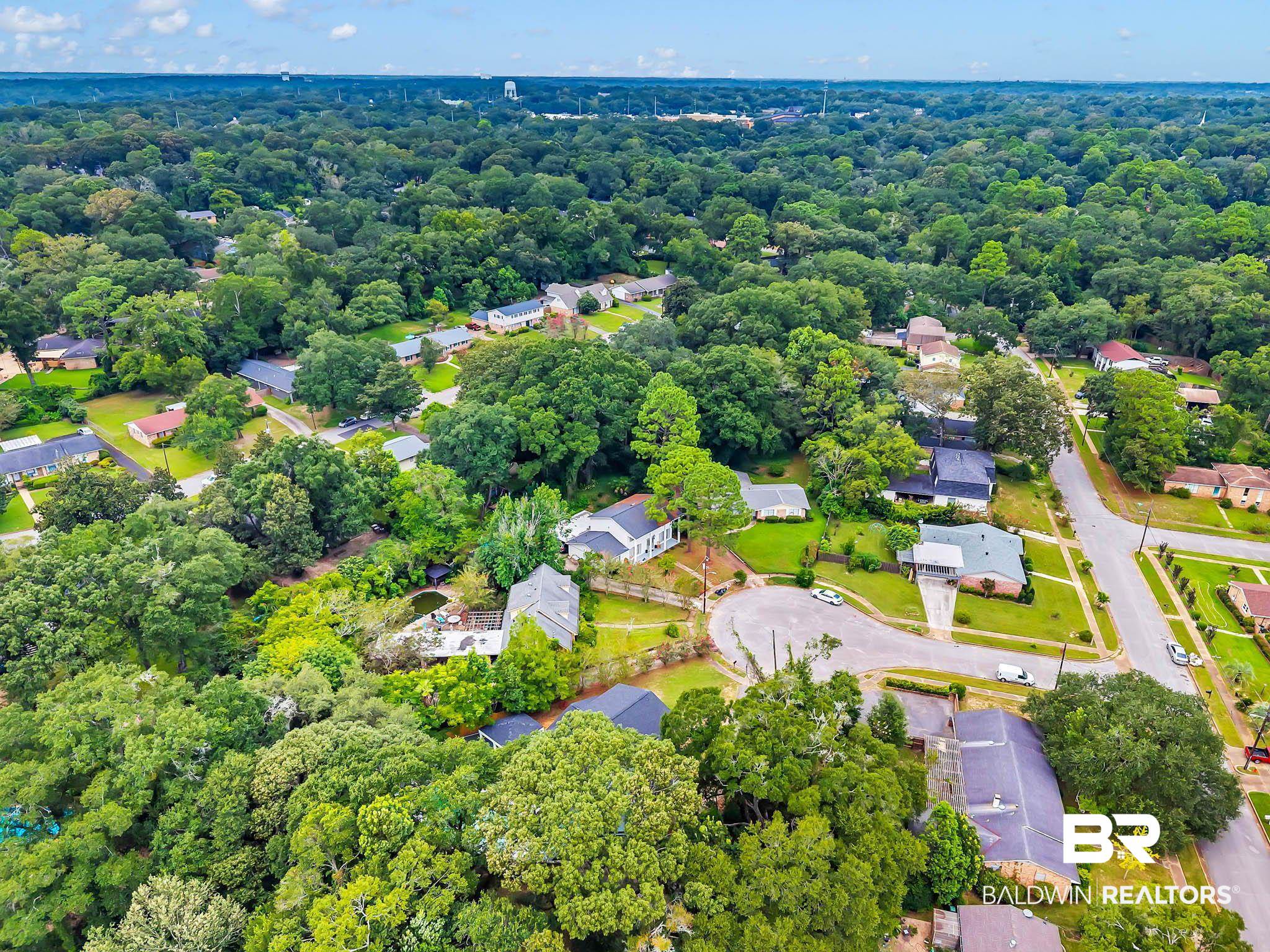 4705 Sherry Court Mobile, AL 36693 - Photo 94 of 100 View of property location featuring nearby suburban area and a heavily wooded area