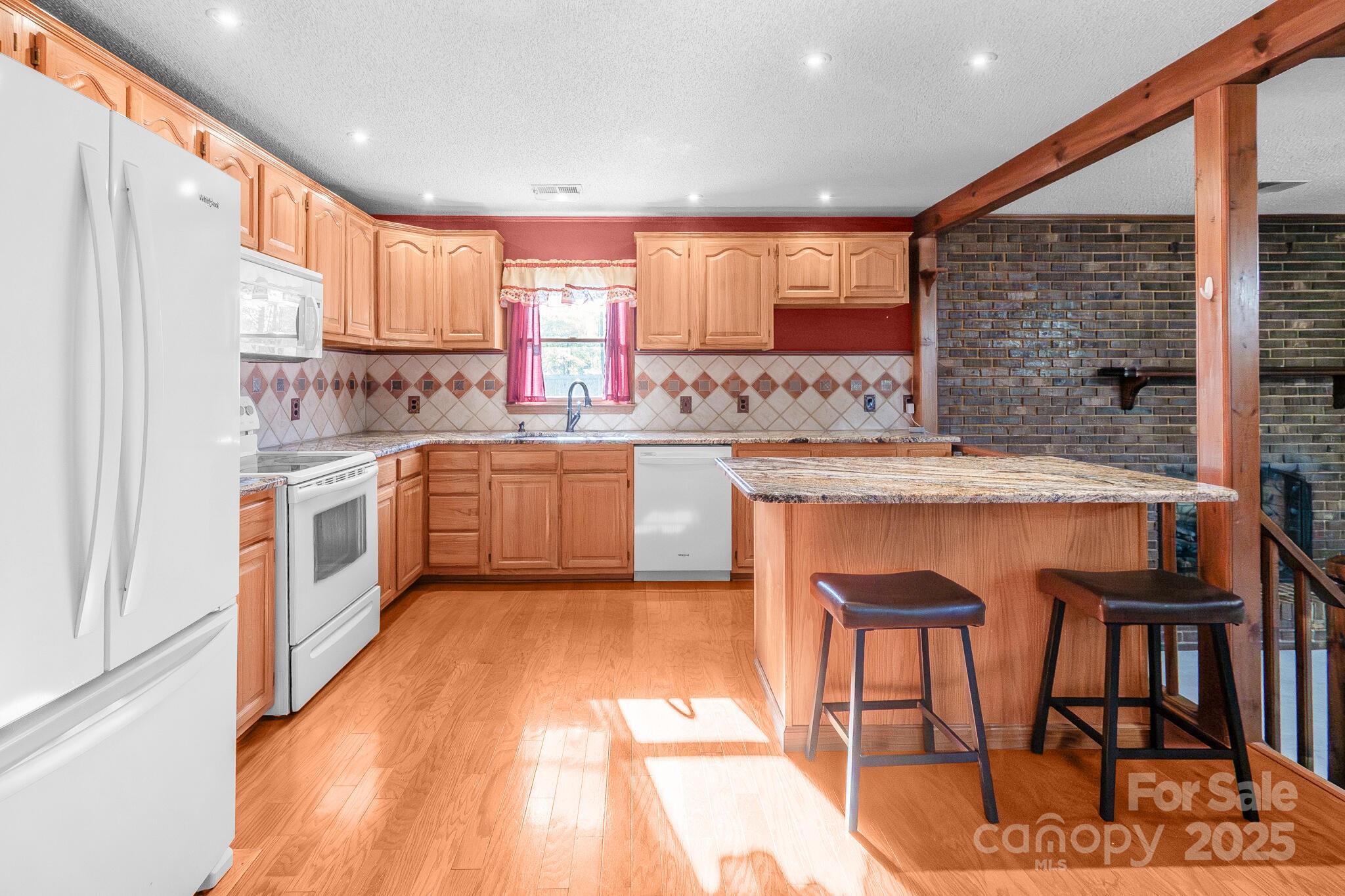 1295 Cattle Ridge Road Cheraw, SC 29520 - Photo 11 of 24 a kitchen with a sink stove and cabinets