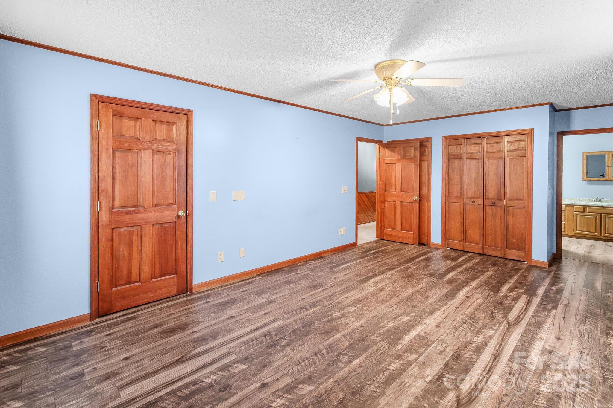 1295 Cattle Ridge Road Cheraw, SC 29520 - Photo 14 of 24 a view of an empty room with window chandelier fan