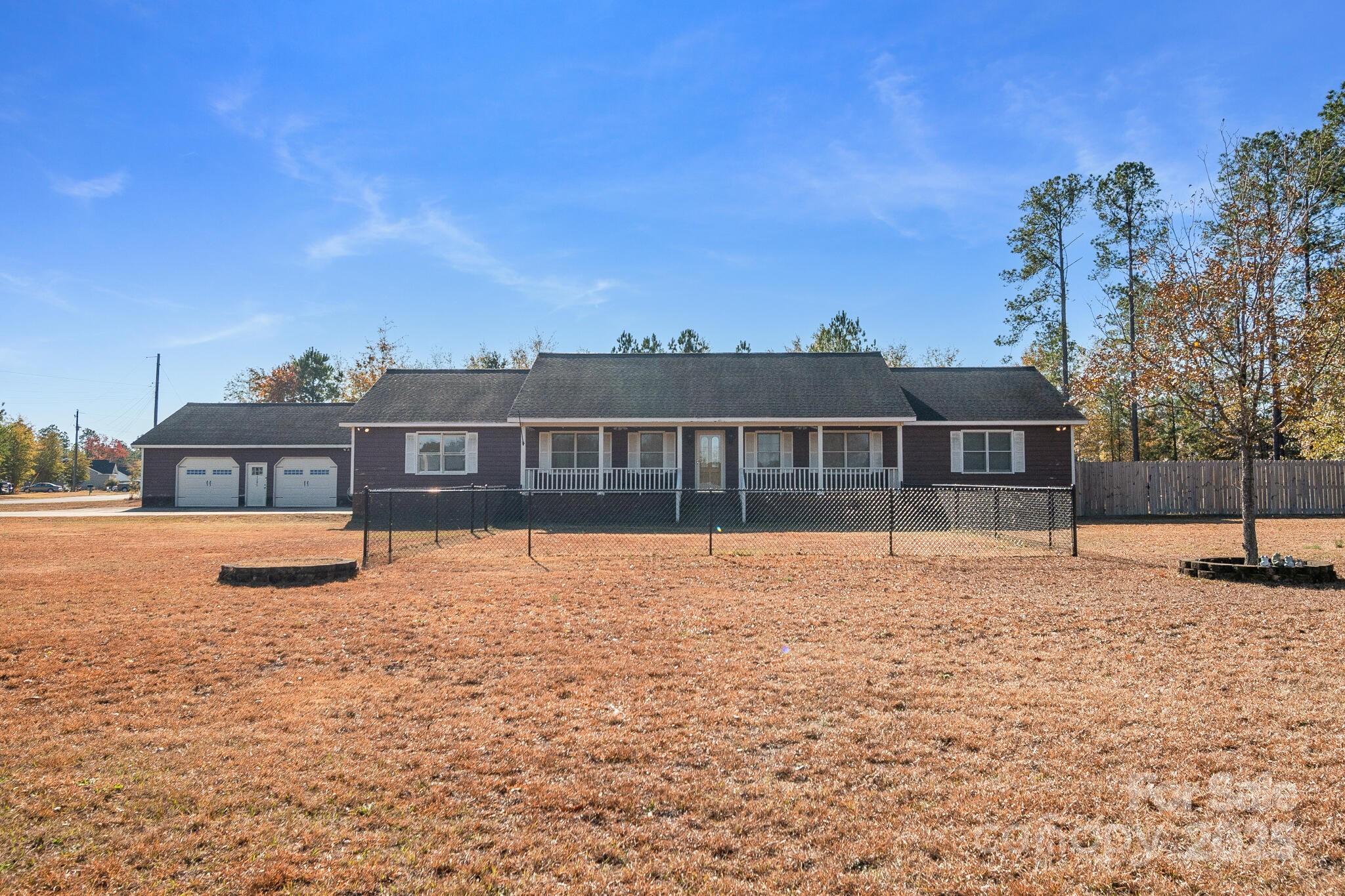 1295 Cattle Ridge Road Cheraw, SC 29520 - Photo 2 of 24 a front view of a house with a yard