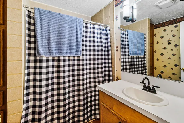 a view of a wooden deck with a yard