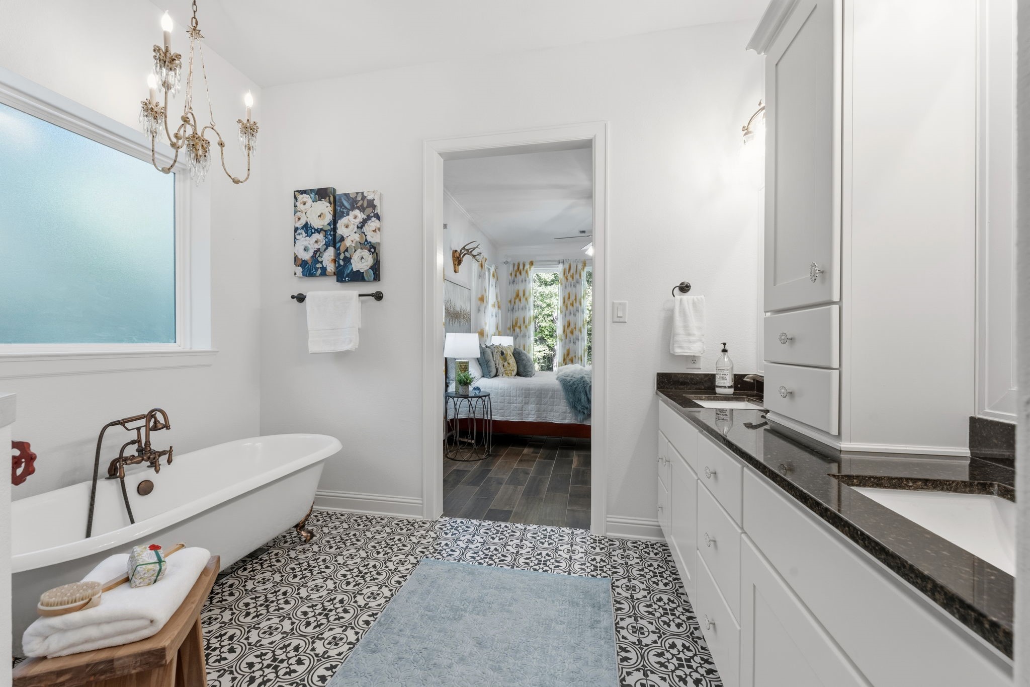 248 Fire Sky Road Huntsville, TX 77340 - Photo 21 of 36 Spacious primary bath offers separate vanities, generous cabinetry, a clawfoot tub and oversized shower for a relaxing, well-designed retreat.