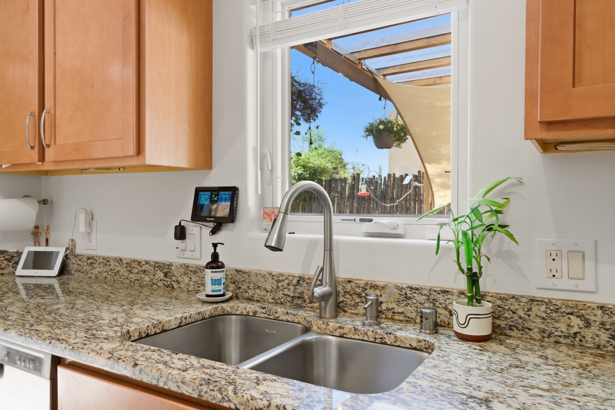 3 Silver Buckle Road Santa Fe, NM 87508 - Photo 16 of 34 Kitchen with window and granite counter tops