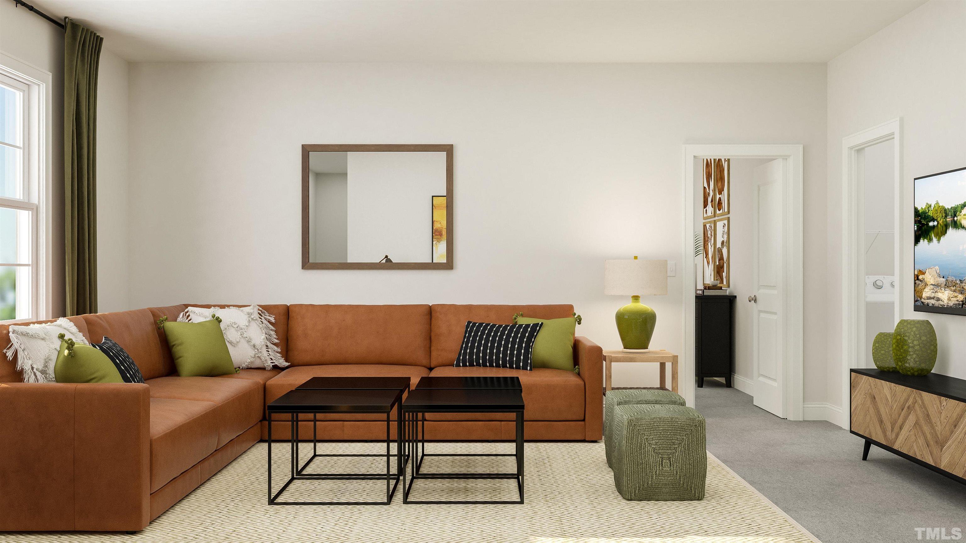 109 Calvander Lane Apex, NC 27539 - Photo 22 of 36 a living room with furniture and a potted plant