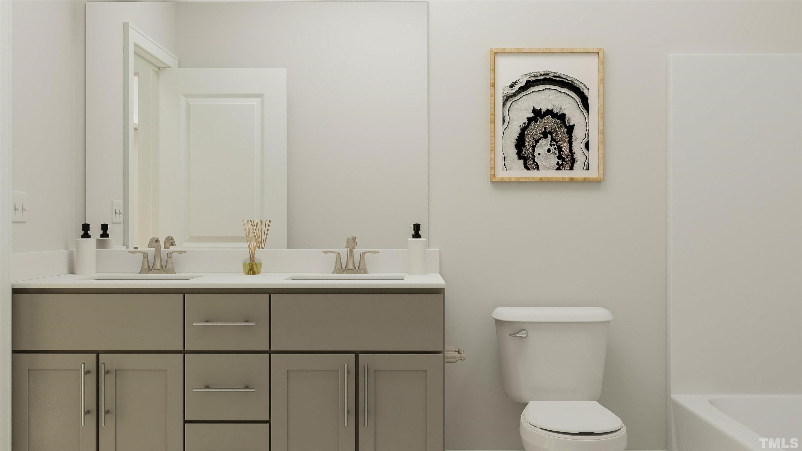 109 Calvander Lane Apex, NC 27539 - Photo 3 of 36 a bathroom with a toilet sink and mirror