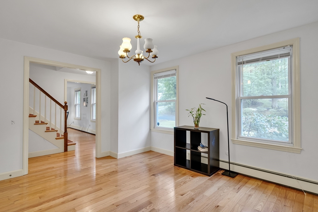 32 Dewey Road Lexington, MA 02420 - Photo 4 of 32 a view of a livingroom with a window and wooden floor
