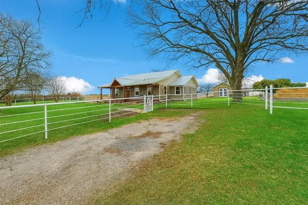 a view of a house with a big yard