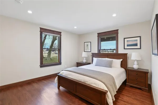 a bedroom with a large bed and a window