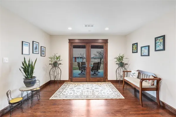 a living room with furniture rug and window