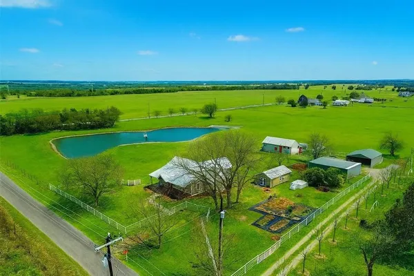 a view of a lake with a big yard