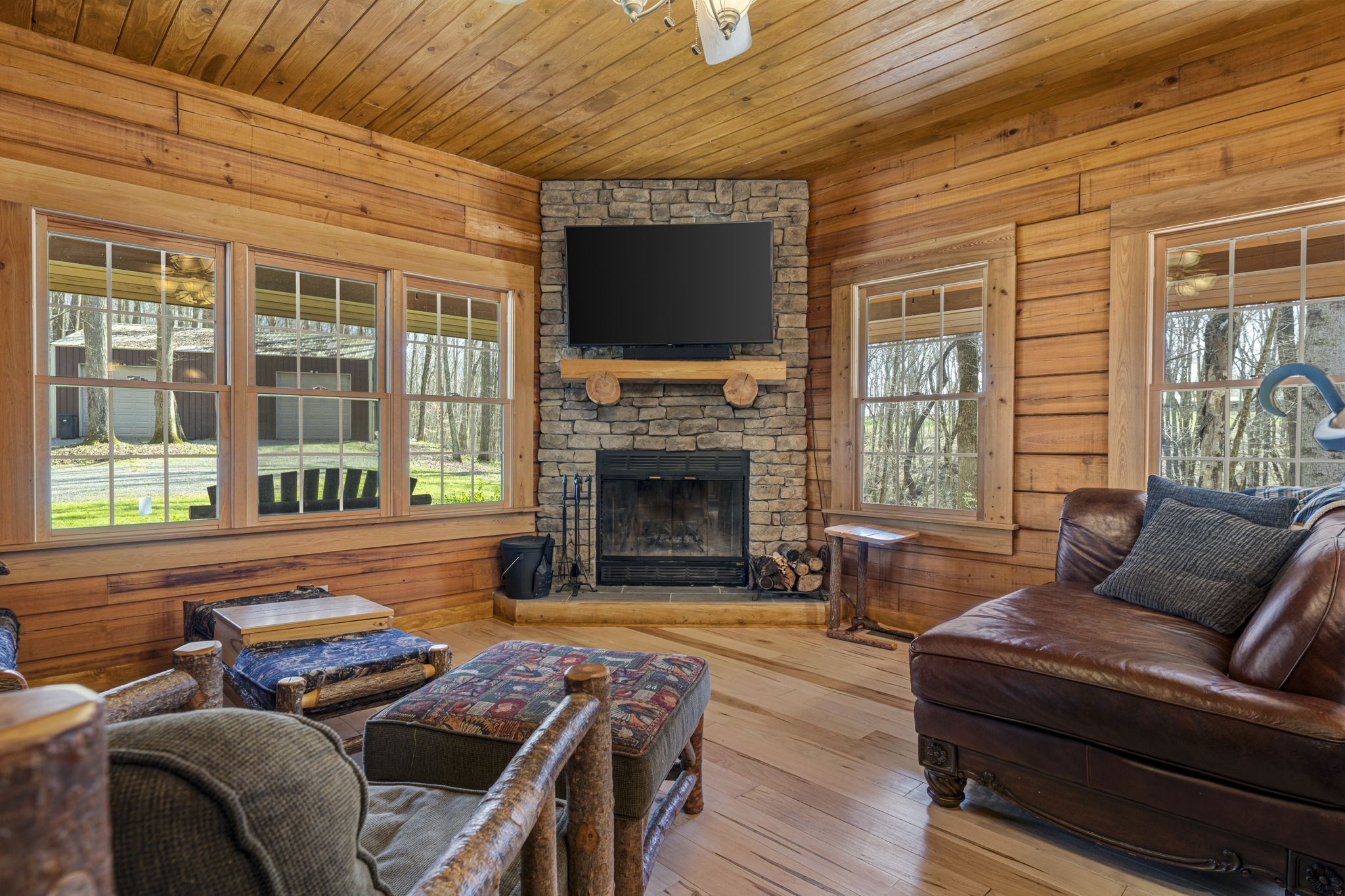 112 Settlers Point Road Fountain Run, KY 42133 - Photo 10 of 30 a living room with furniture a flat screen tv and a fireplace